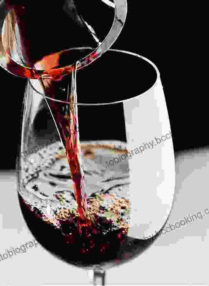 A Glass Of Red Bordeaux Wine Being Poured Into A Decanter Bordeaux: Complete (Guides To Wines And Top Vineyards 22)