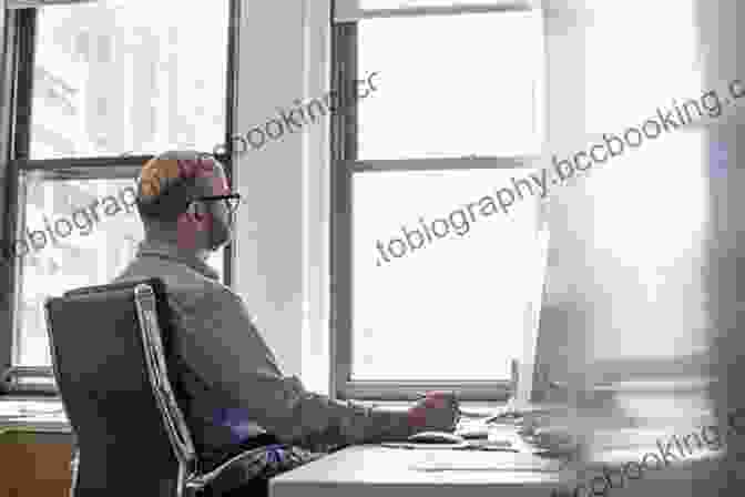 A Leader Sitting At A Desk, Looking Intently At A Computer Screen While Making A Decision. Leadership: Discover The Qualities Of Leaders And How To Use Them In Your Own Life For Ultimate Success