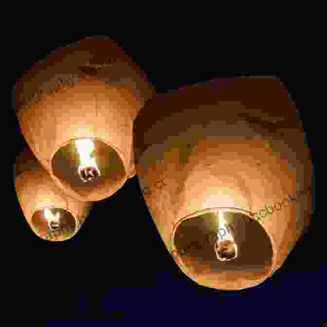 A Paper Lantern Floating Up Into The Night Sky, Symbolizing The Release Of A Wish. Ten Rules Of The Birthday Wish