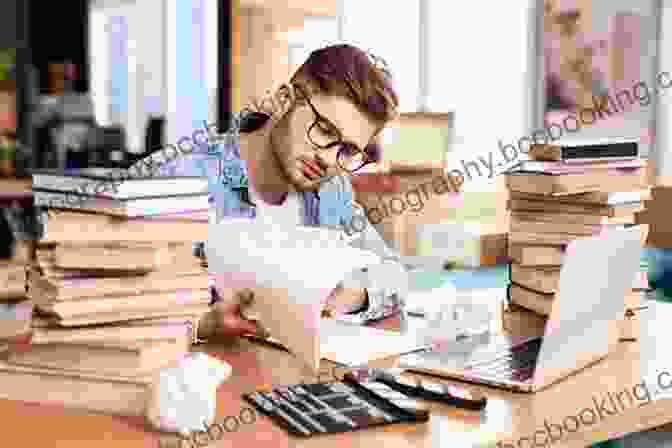 A Photo Of A Writer Sitting At A Desk, Surrounded By Books And Writing Materials. The Writer Is Deep In Thought, Their Fingers Hovering Over The Keyboard. Remembered Rapture: The Writer At Work