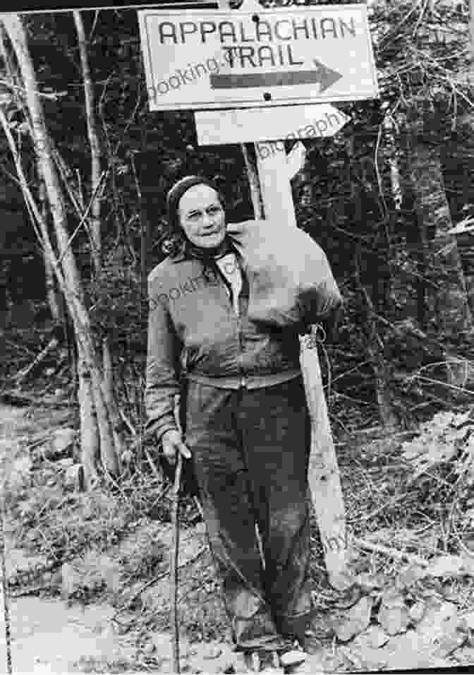A Photo Of Grandma Gatewood Hiking On The Appalachian Trail, Wearing A Backpack And Carrying A Walking Stick, Surrounded By Lush Greenery. Grandma Gatewood S Walk: The Inspiring Story Of The Woman Who Saved The Appalachian Trail