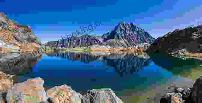 A Serene Mountain Lake, With Jagged Peaks Reflected In Its Crystal Clear Waters Journeys North: The Pacific Crest Trail