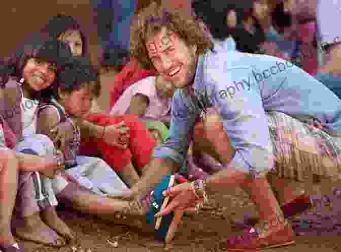 Blake Mycoskie Giving A Shoe To A Child As Part Of The TOMS Shoes' One For One Model Start Something That Matters Blake Mycoskie